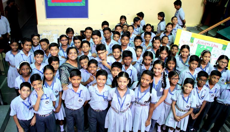 KMR nursery children smiling in class
